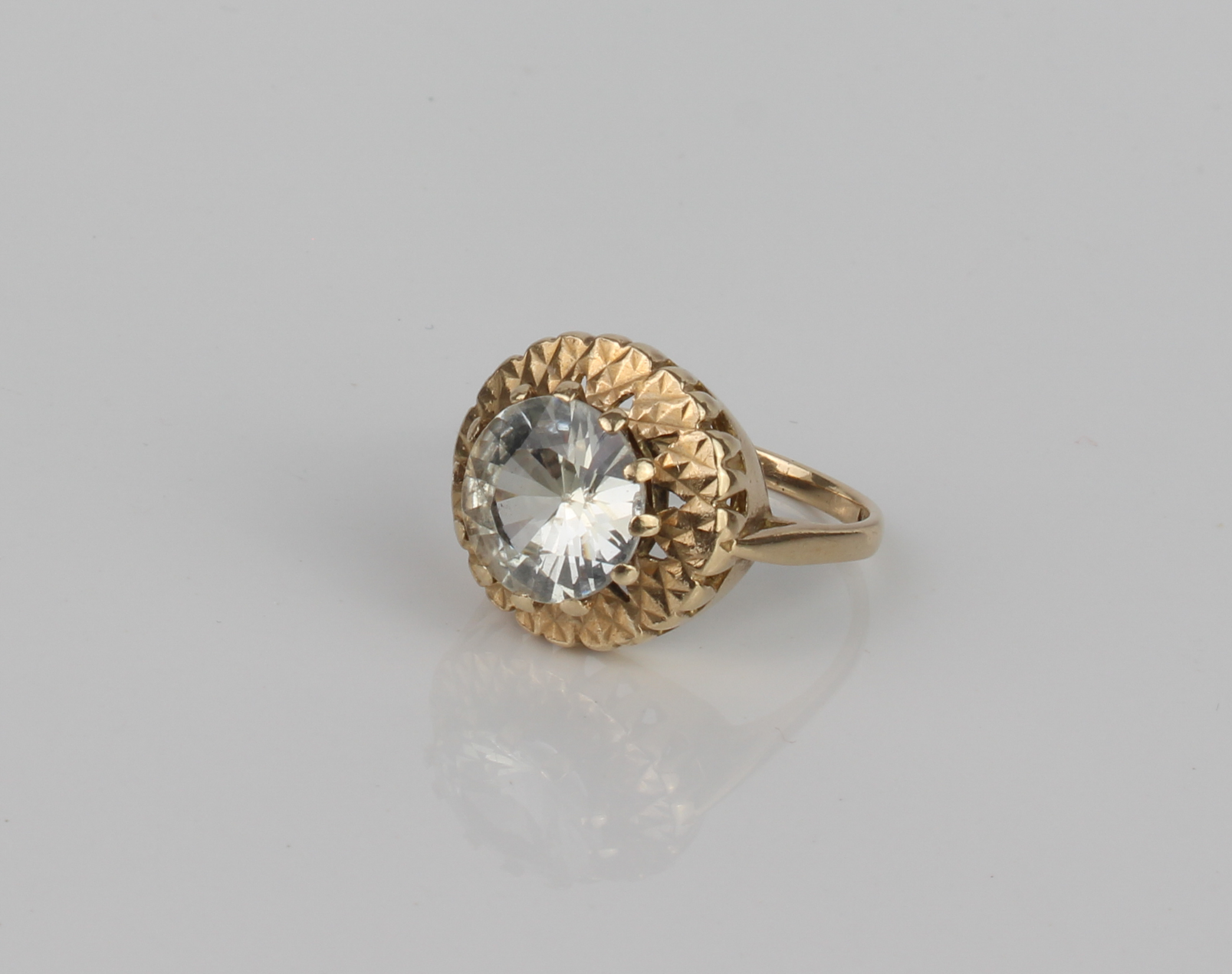 A vintage 9ct gold ring set with a large white stone - hallmarked London 1967, the claw set 9.75