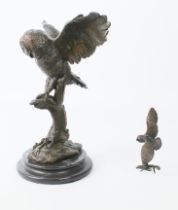 Two bronze owl figures: 1. late 20th century, modelled with wings outstretched, landing upon a