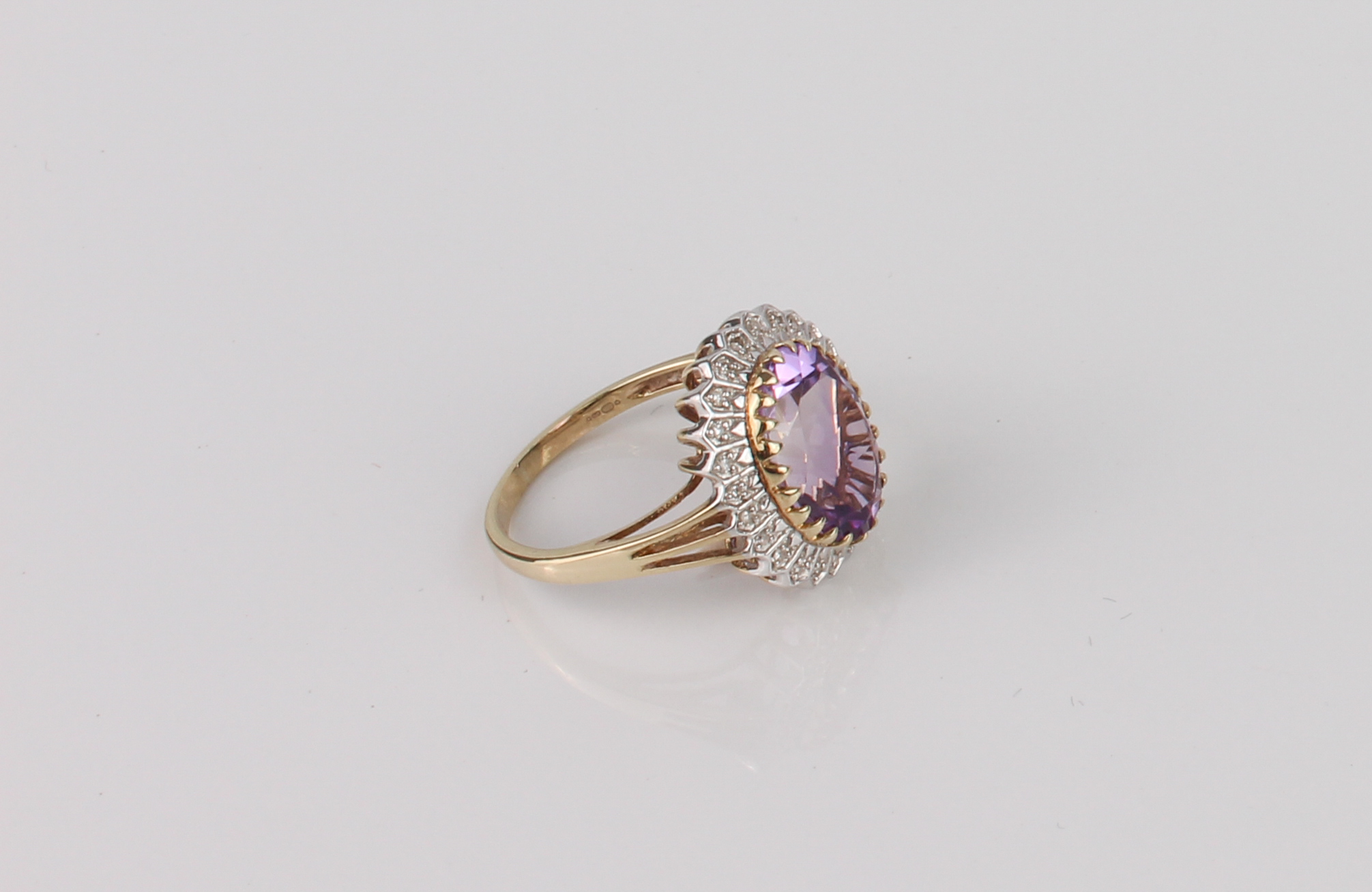A Danbury Mint 9ct gold, amethyst and diamond cluster ring - 'The Grandeur Ring', with an oval cut - Image 2 of 5