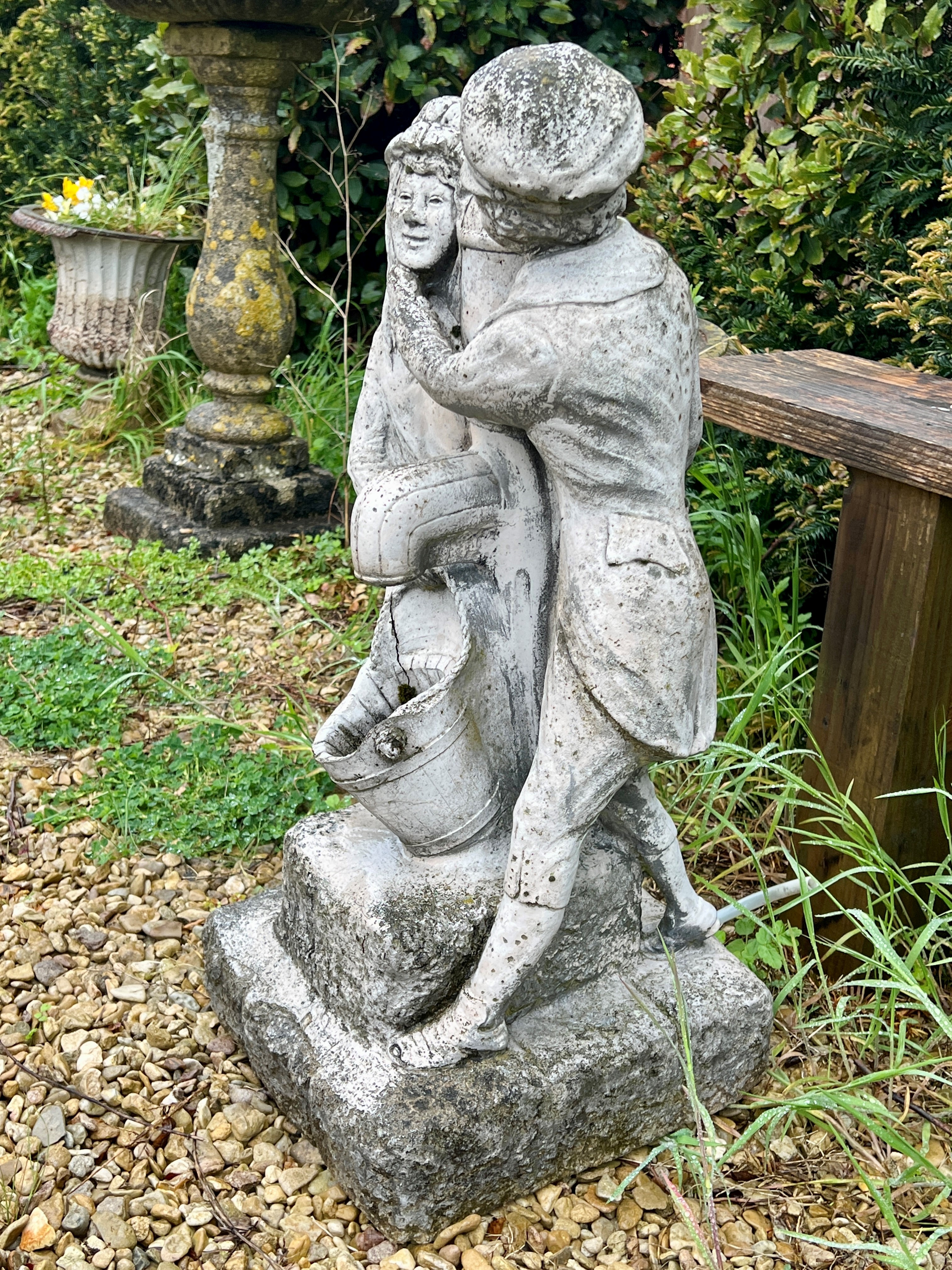 A composite stone water feature - depicting a couple standing beside a water tap, 76cm high. - Image 3 of 3