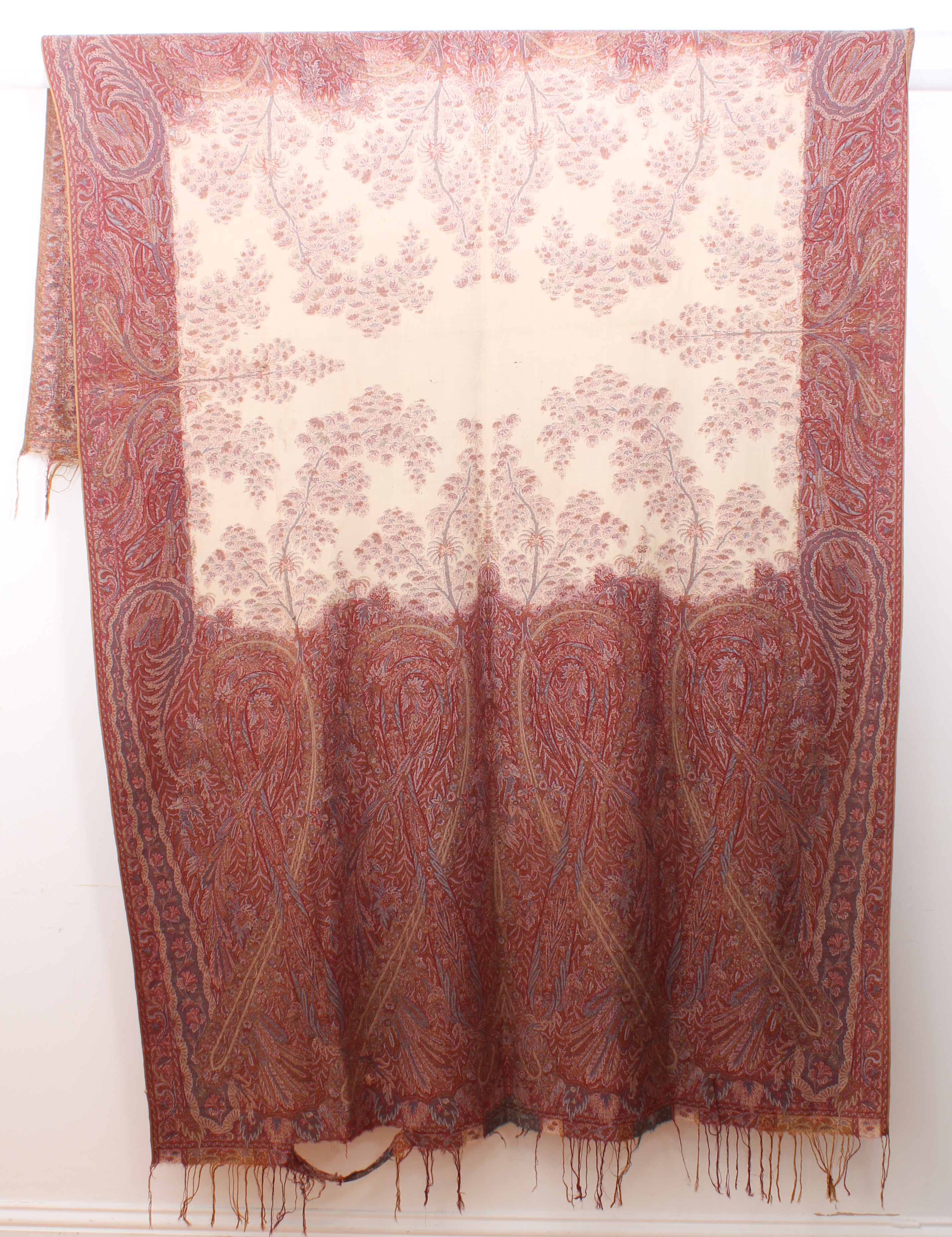 An antique Paisley shawl - probably early 20th century, with central ivory field decorated with