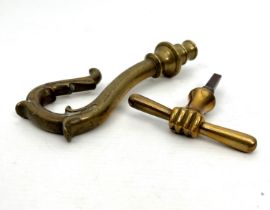 An antique bronze crook shaped staff handle - probably 19th century, with foliate decoration and