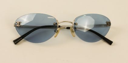 A pair of cased Chanel lady's sunglasses - ref. 4003 c103/72, with blue-tinted rimless lenses and