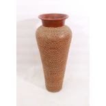 A very large floorstanding terracotta vase - with woven rattan exterior decoration, 98 cm high, a