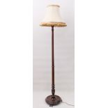 A mahogany standard lamp - 1930s, with fluted column, to a dished base with bracket feet, 153 cm