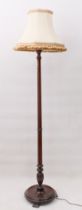 A mahogany standard lamp - 1930s, with fluted column, to a dished base with bracket feet, 153 cm