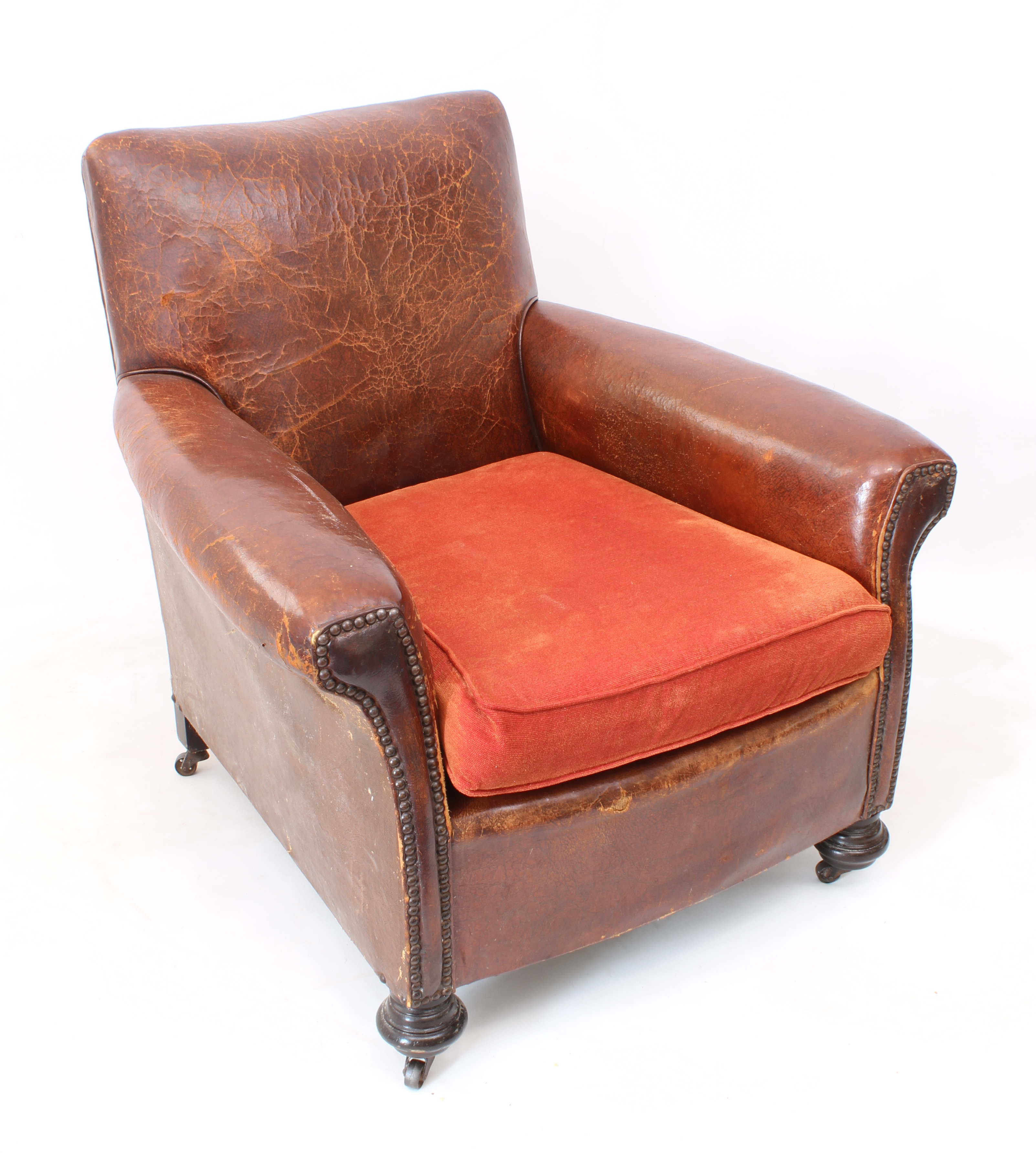 An Art Deco leather club chair - 1920s-30s, in tan studded leather with rexine sides and loose