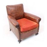 An Art Deco leather club chair - 1920s-30s, in tan studded leather with rexine sides and loose