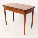 A mid-19th century mahogany rectangular fold-over tea table - with a boxwood edge banded frieze,