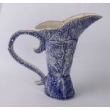 An unusual Continental blue and white pottery ewer - with three-part boot-shaped body and S-scroll