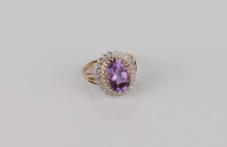 A Danbury Mint 9ct gold, amethyst and diamond cluster ring - 'The Grandeur Ring', with an oval cut