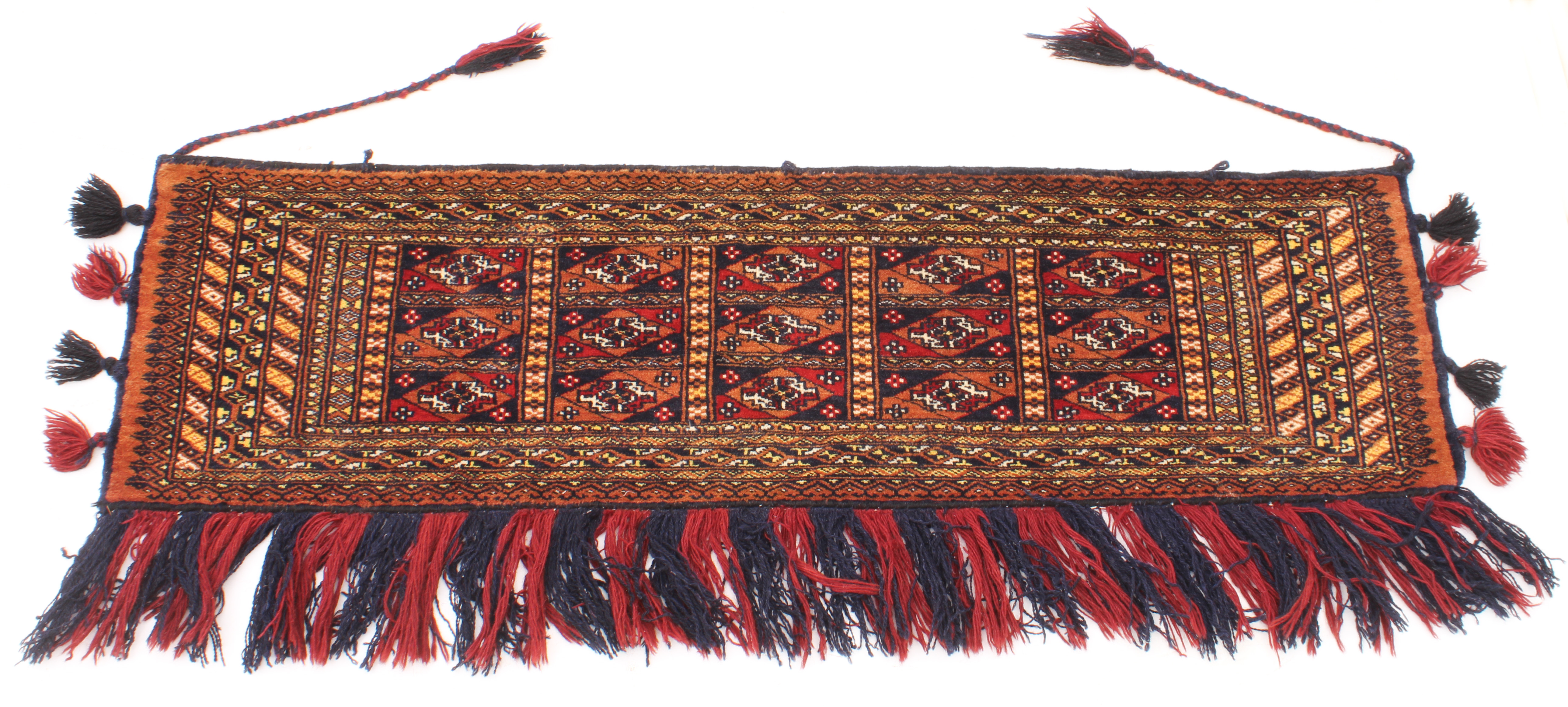 A Turkoman hand-knotted wool wall-hanging - second half 20th century, the panelled field within