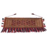 A Turkoman hand-knotted wool wall-hanging - second half 20th century, the panelled field within