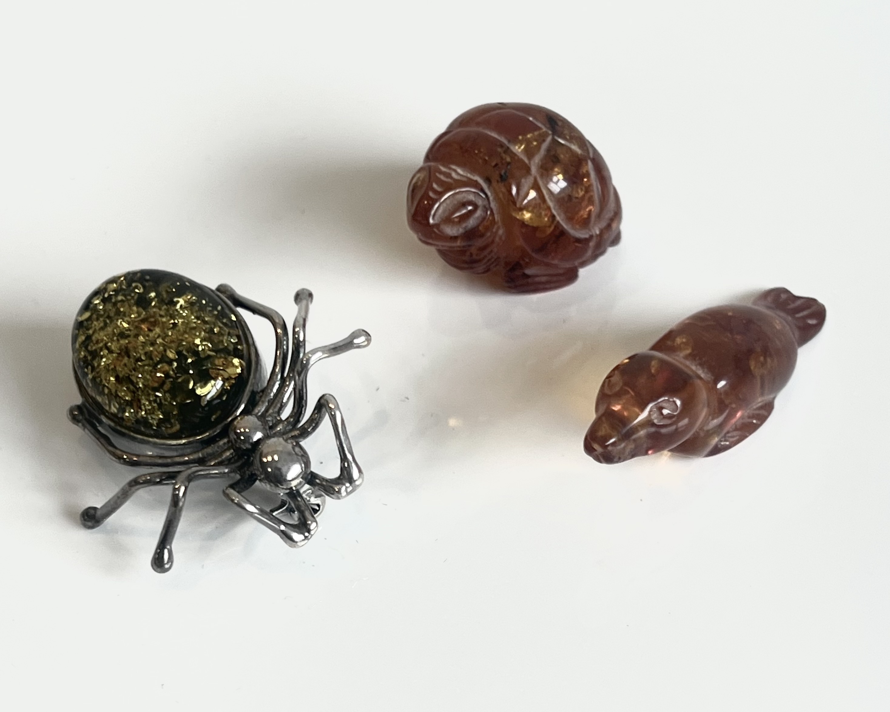 A sterling silver and Baltic amber spider brooch - stamped 925, 33mm long; together with a miniature