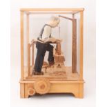 A fine carved wooden automaton of a woodworker, 'The Pole Lathe' - late 20th century, the carved