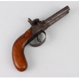 A 19th century double-barrel side by side percussion pistol.