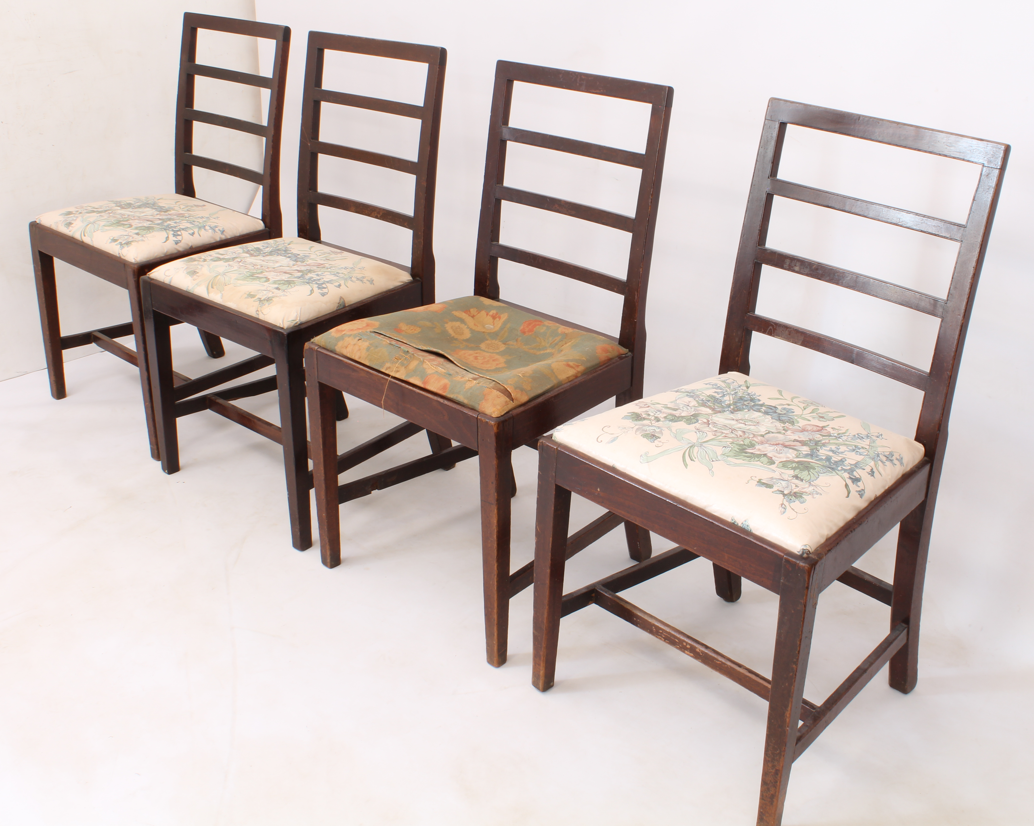 A set of four 19th century mahogany ladderback dining chairs - with drop-in seats, raised on