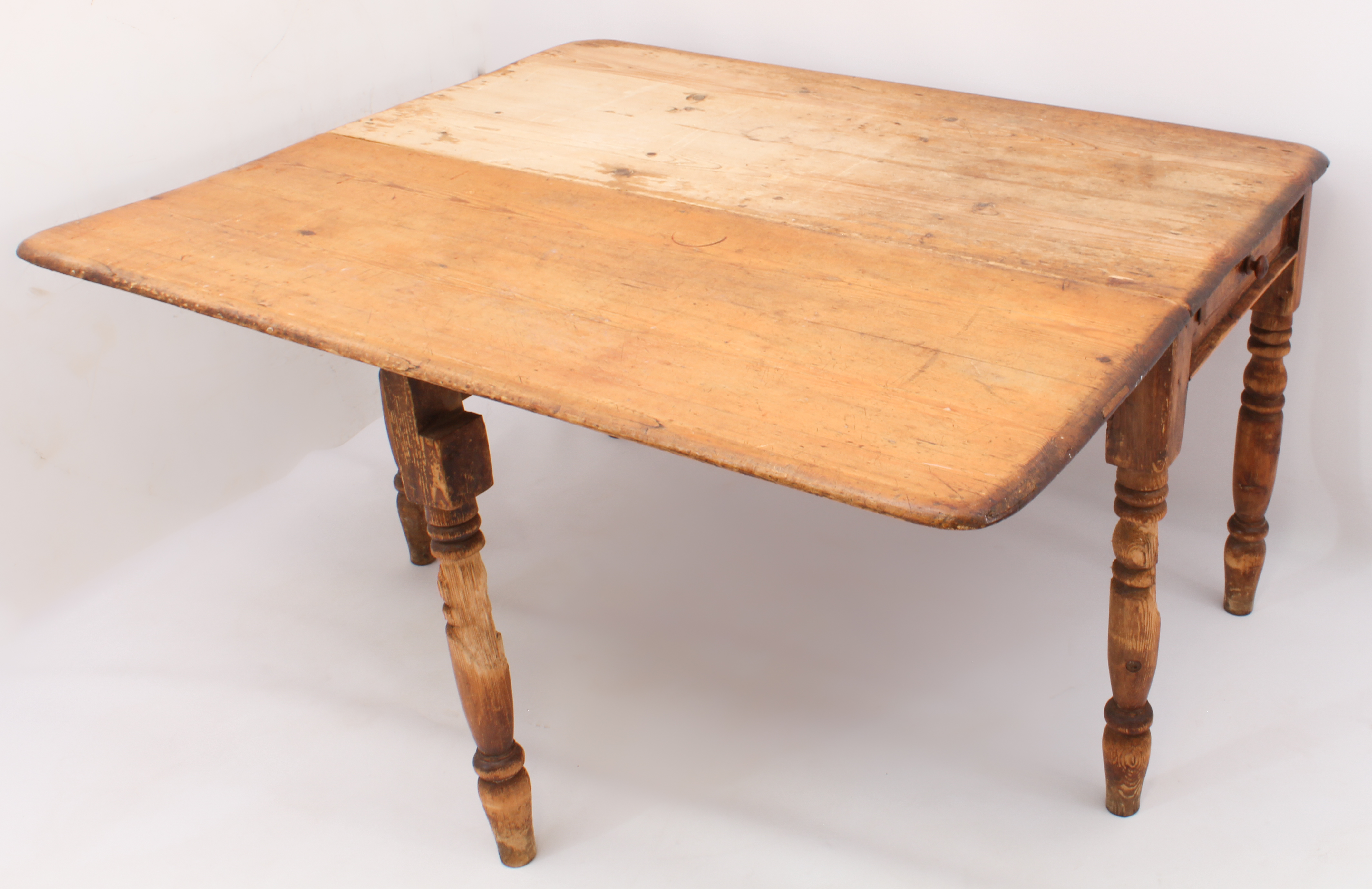 A 19th century pine farmhouse dining table with single dropflap - the rectangular top over two end- - Image 3 of 3