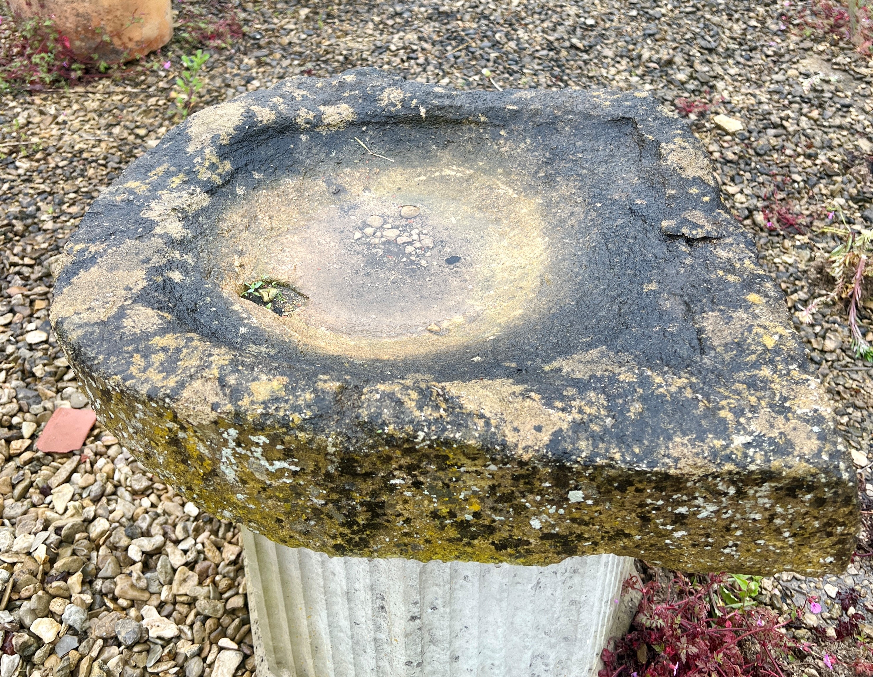 A Cotswold stone shallow trough or bird bath - one end slightly V-shaped, 54 x 51cm, 10cm high.