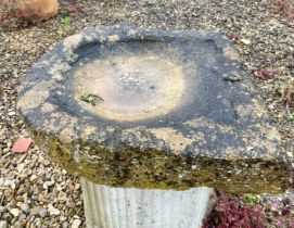 A Cotswold stone shallow trough or bird bath - one end slightly V-shaped, 54 x 51cm, 10cm high.