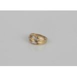A 9ct gold and diamond ring - hallmarked Sheffield 1994, the foliate two-colour setting accented