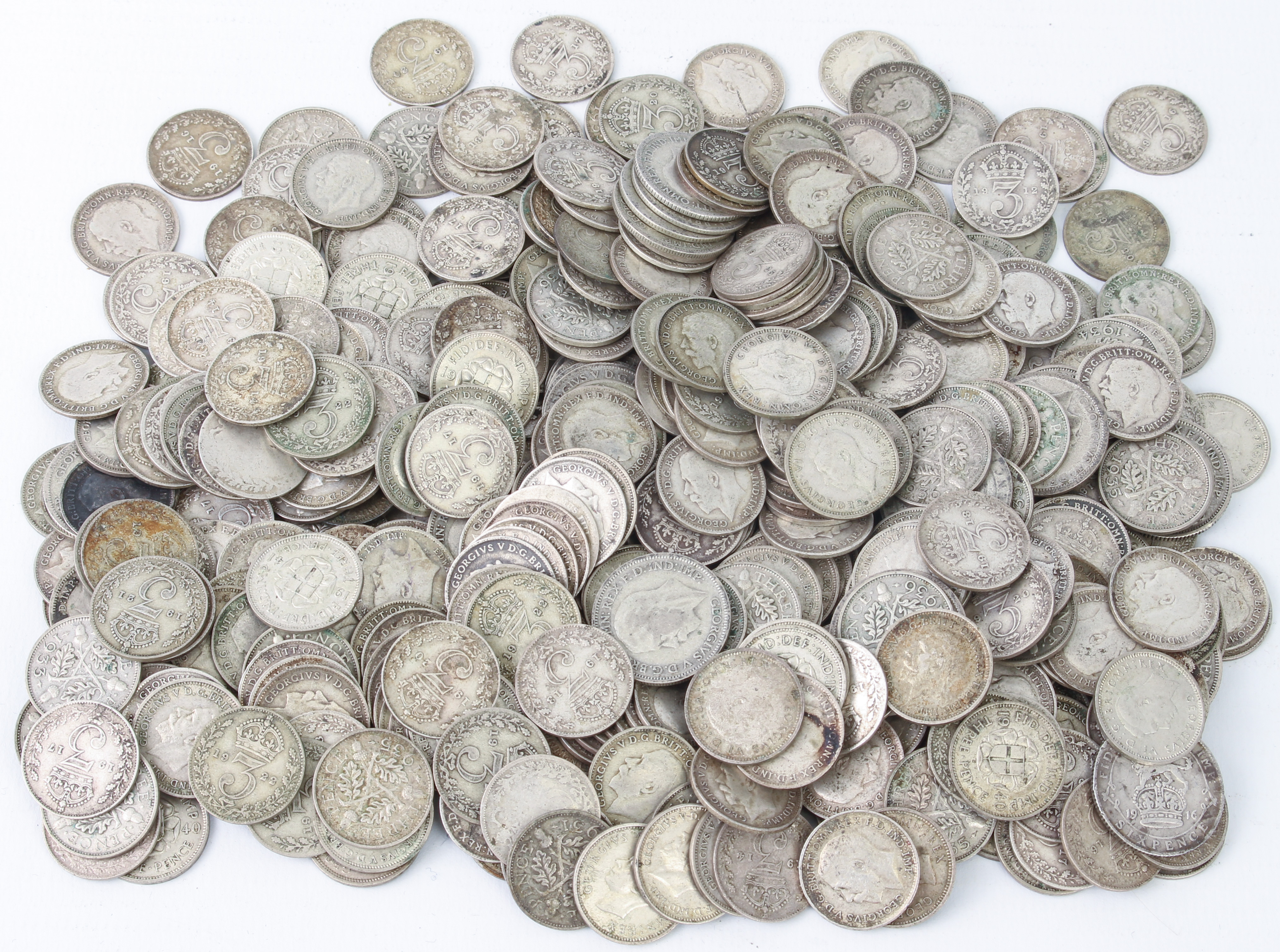 Approximately 400 George V threepenny pieces (579g) and 19 GV sixpences