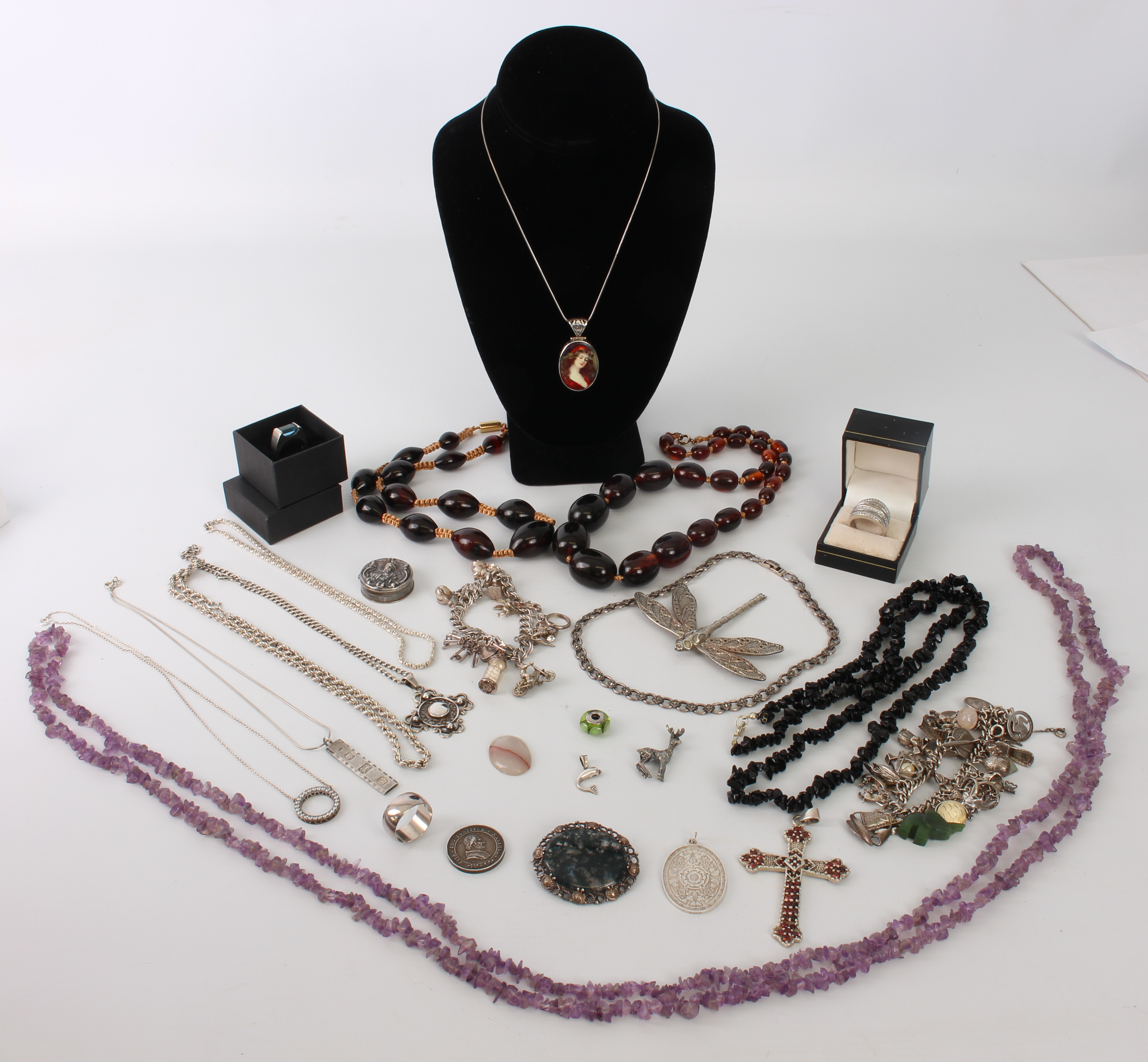 A collection of mostly 925 sterling silver jewellery (some boxed) - including two charm bracelets,