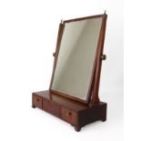 An early 19th century mahogany box base toilet mirror - with a rectangular plate and three drawer