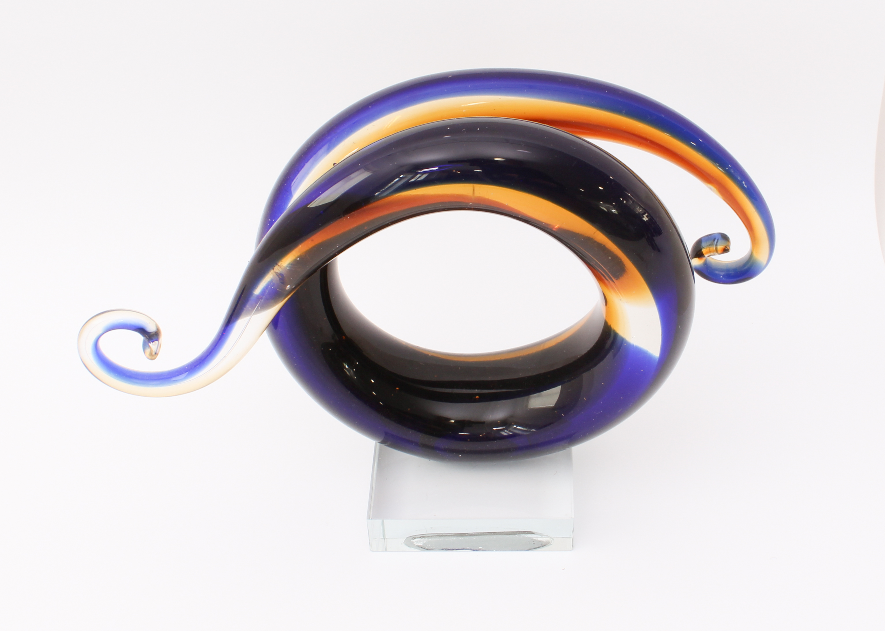 An art glass sculpture - of scrolled, spiral form, in dark-blue, amber and clear glass, each end - Image 2 of 4