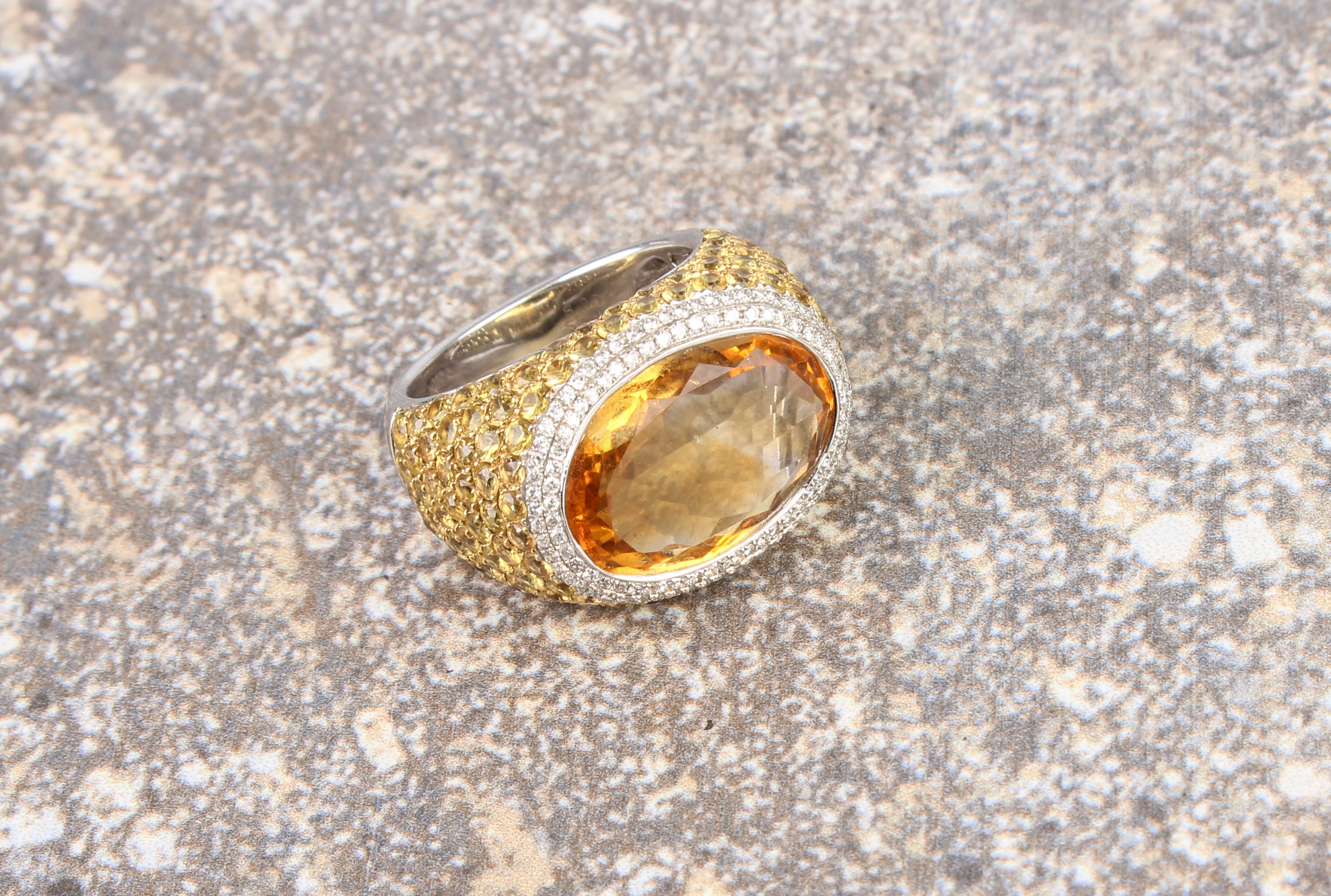 An impressive 18ct gold, citrine, yellow sapphire and diamond ring - marked 'K18 750', the 8.05ct