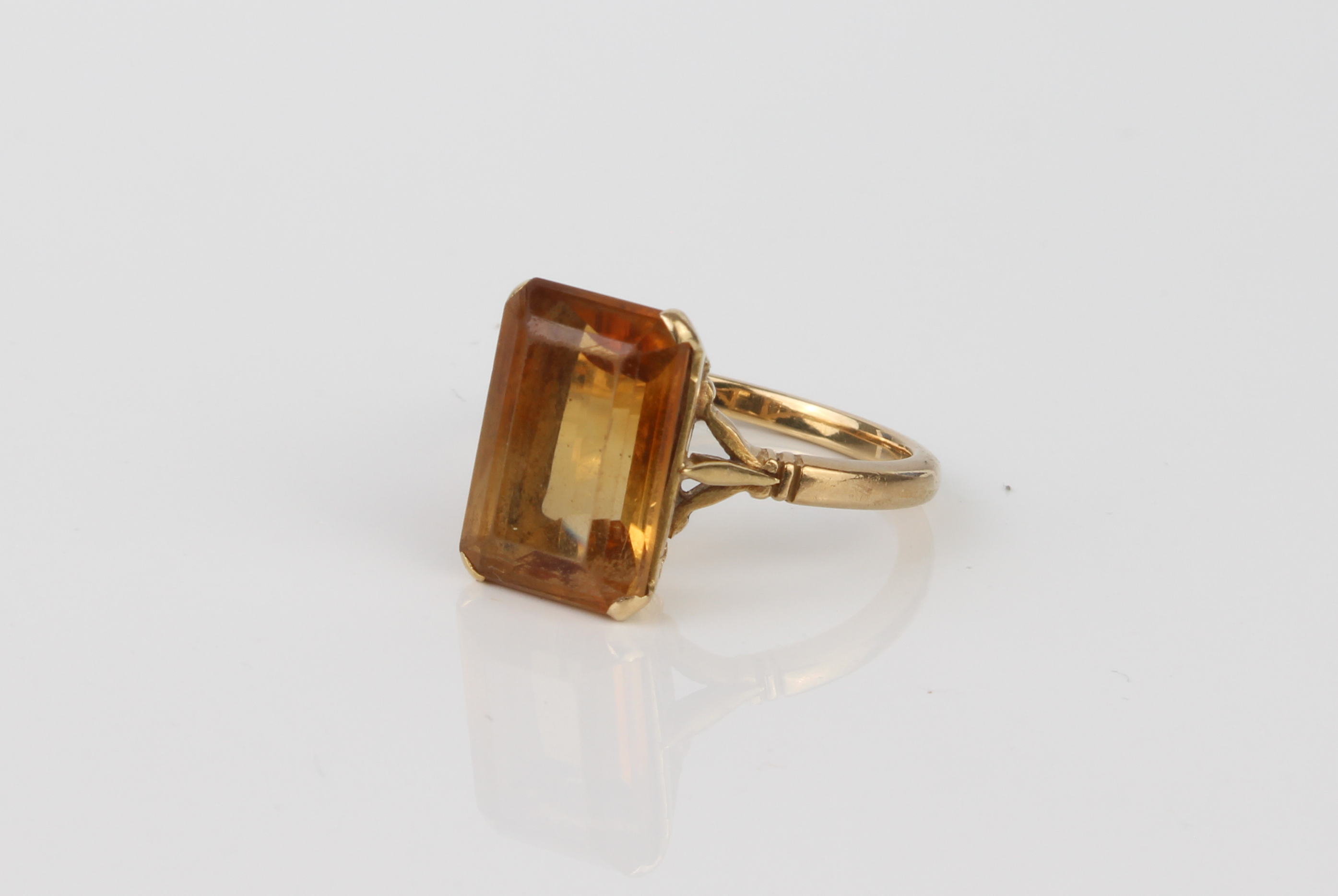 An 18ct yellow gold and yellow stone ring - unmarked, tests as 18ct gold, probably yellow