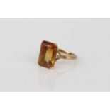 An 18ct yellow gold and yellow stone ring - unmarked, tests as 18ct gold, probably yellow