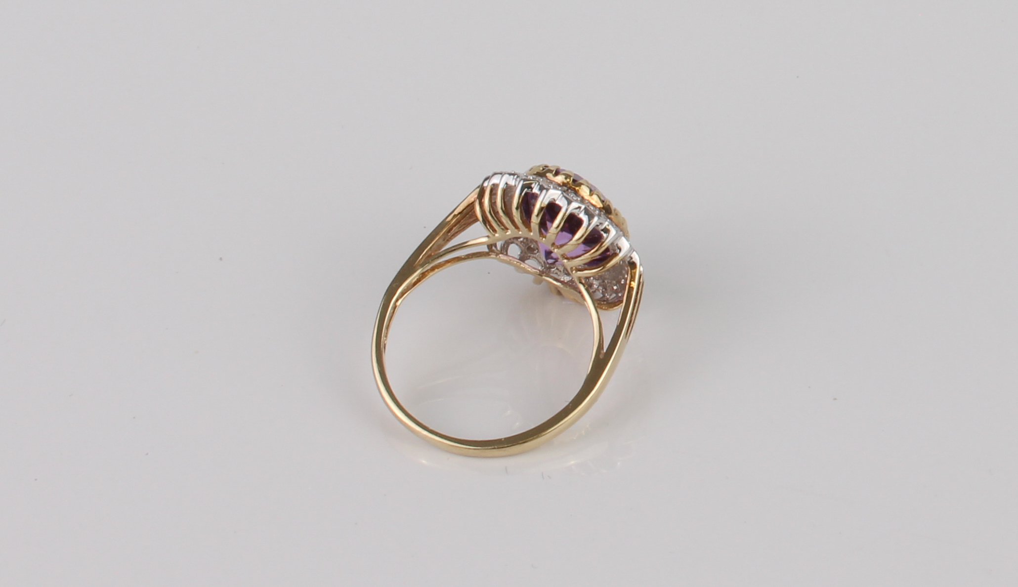 A Danbury Mint 9ct gold, amethyst and diamond cluster ring - 'The Grandeur Ring', with an oval cut - Image 3 of 5