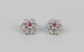 A pair of good quality 18ct white gold, ruby and diamond floral cluster earrings - unmarked, test as