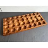 A teak storage box - modern, the interior with fifteen carved spherical recesses to each side,