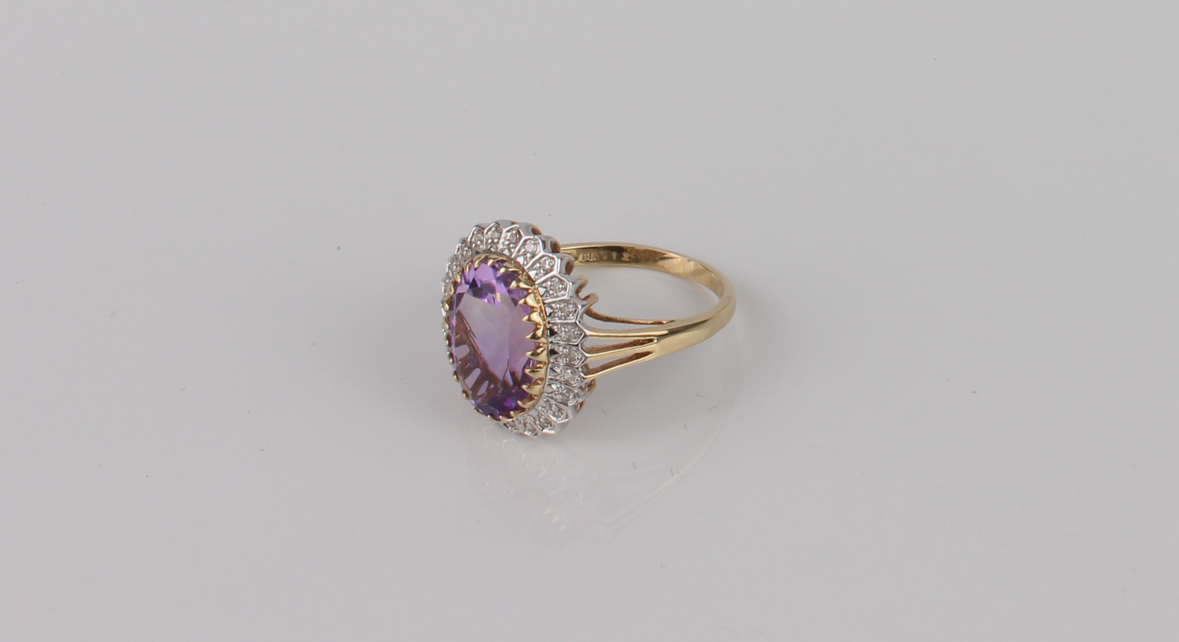 A Danbury Mint 9ct gold, amethyst and diamond cluster ring - 'The Grandeur Ring', with an oval cut - Image 4 of 5