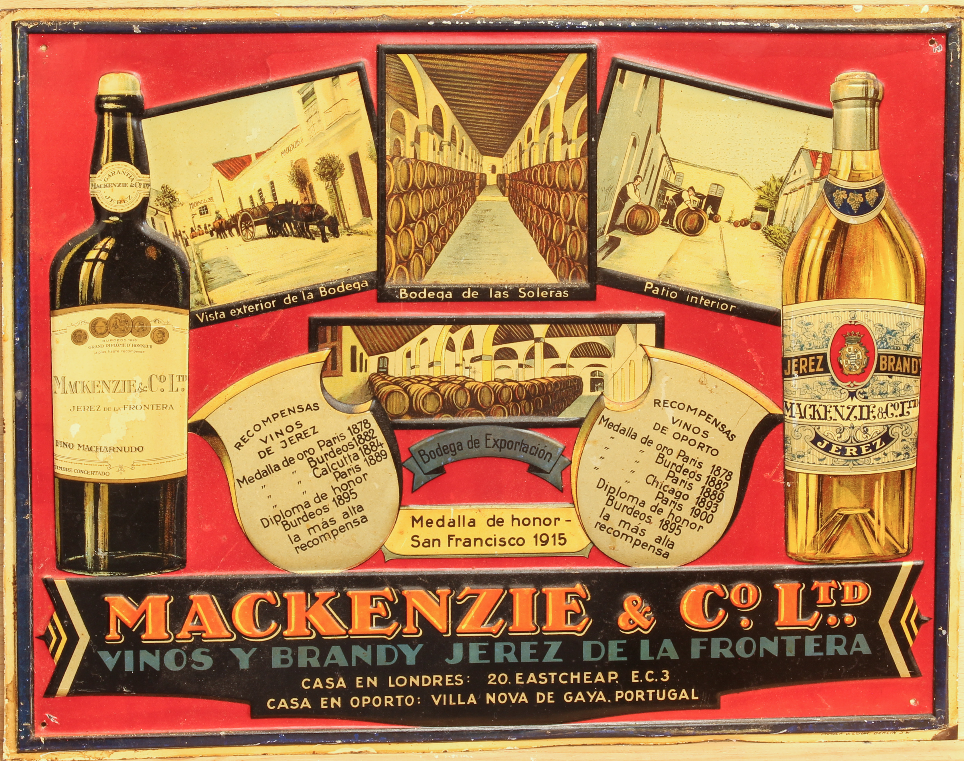 A vintage pressed lithographed tin advertising sign for Mackenzie & Co. Ltd. wine and brandy -