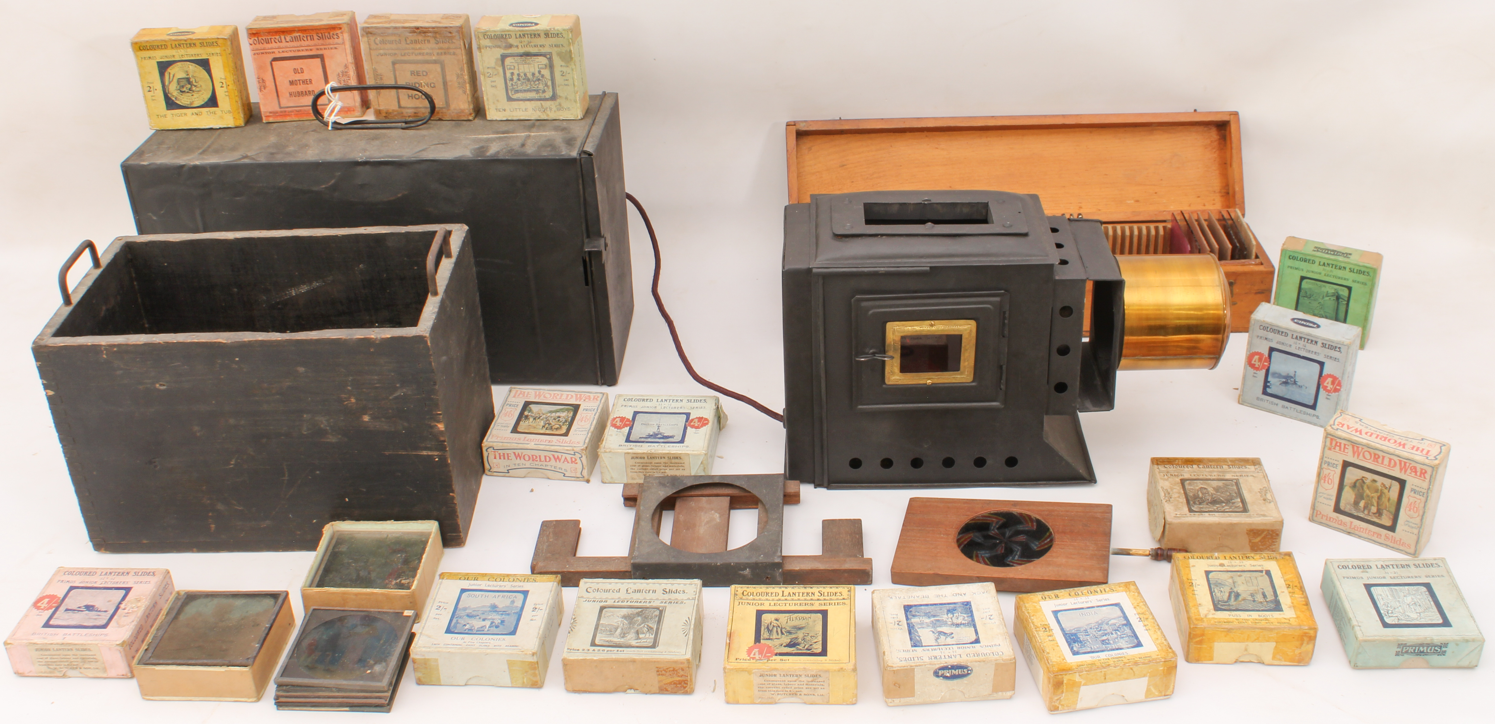 A cased magic lantern and a good quantity of slides to include: a mahogany and gilt-brass hand- - Image 8 of 14