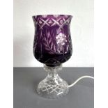 An amethyst cased glass table-lamp, possibly Scottish - the tulip-shaped shade with floral, diamond,