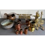 Ten pieces of copper and brass ware: a Turkish brass Dallah and similar brass tankard; a nested