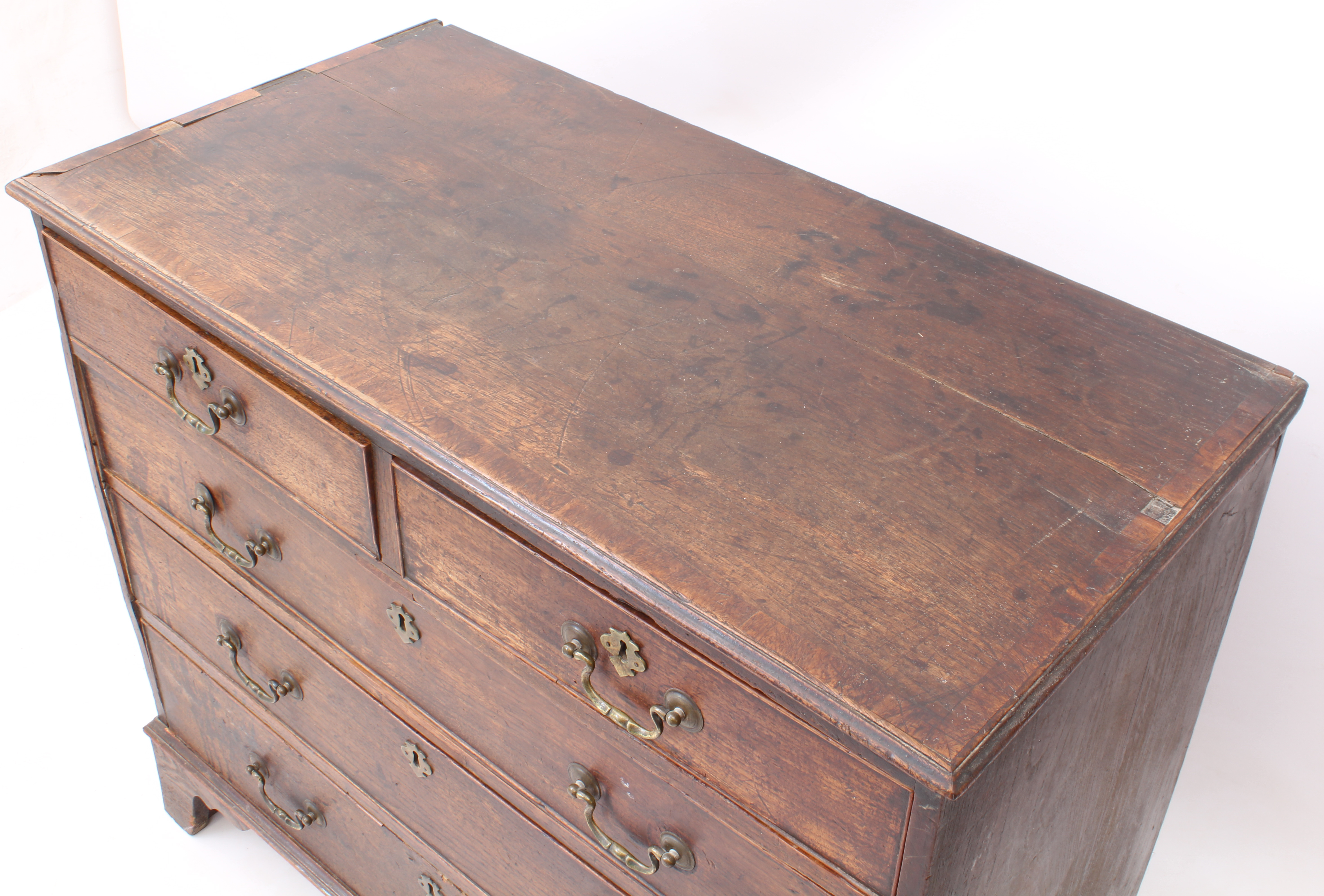 A George III oak and mahogany crossbanded straight-front chest of drawers - the moulded top over two - Image 3 of 3