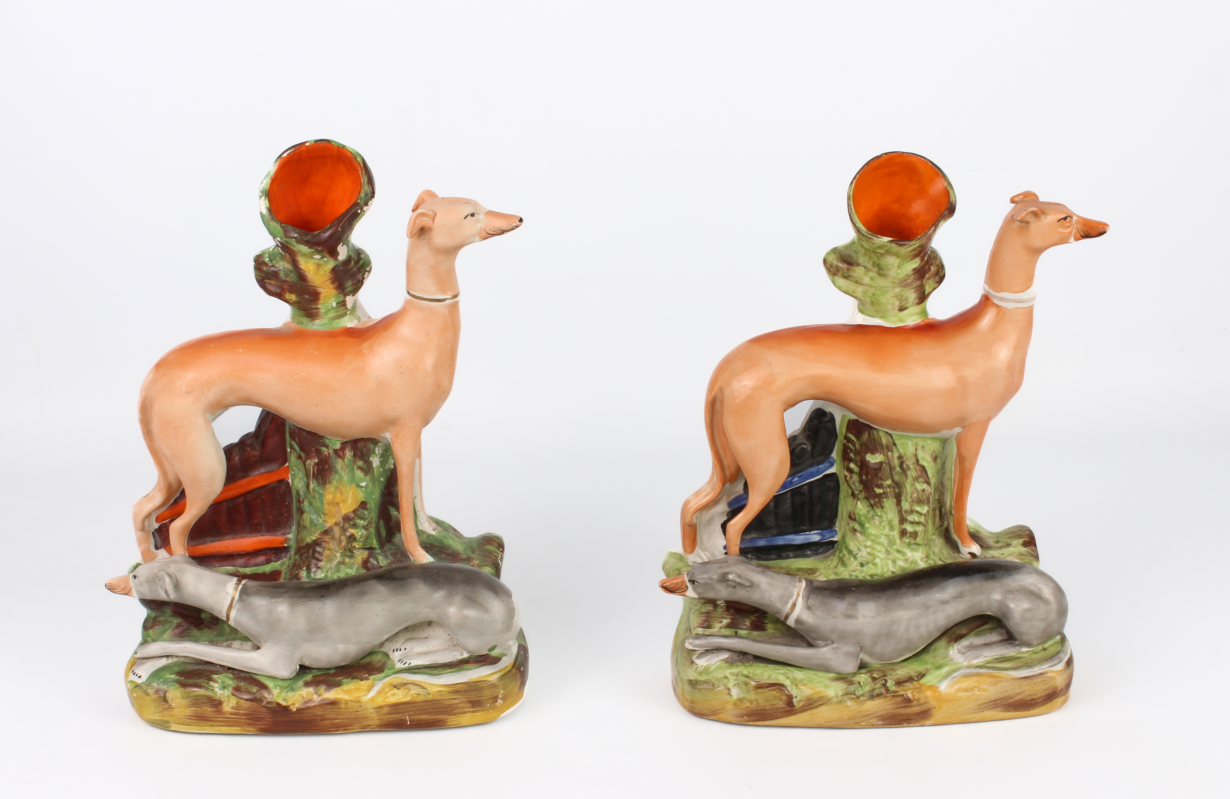 A closely matched pair of Staffordshire pottery greyhound spill vases - 19th century, both right