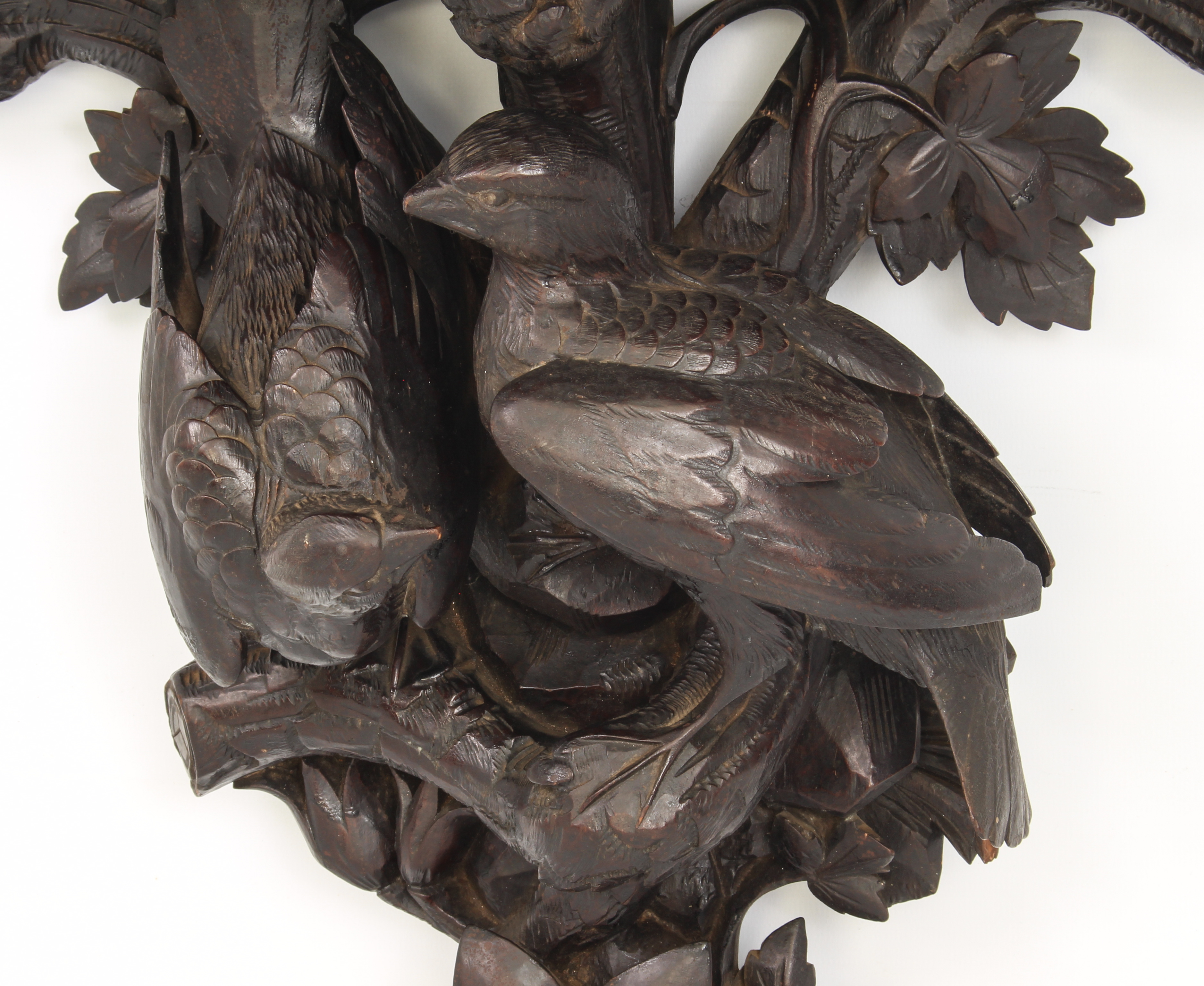 A late 19th century French carved and ebonised wooden clock bracket - probably lime wood, the demi- - Image 3 of 4