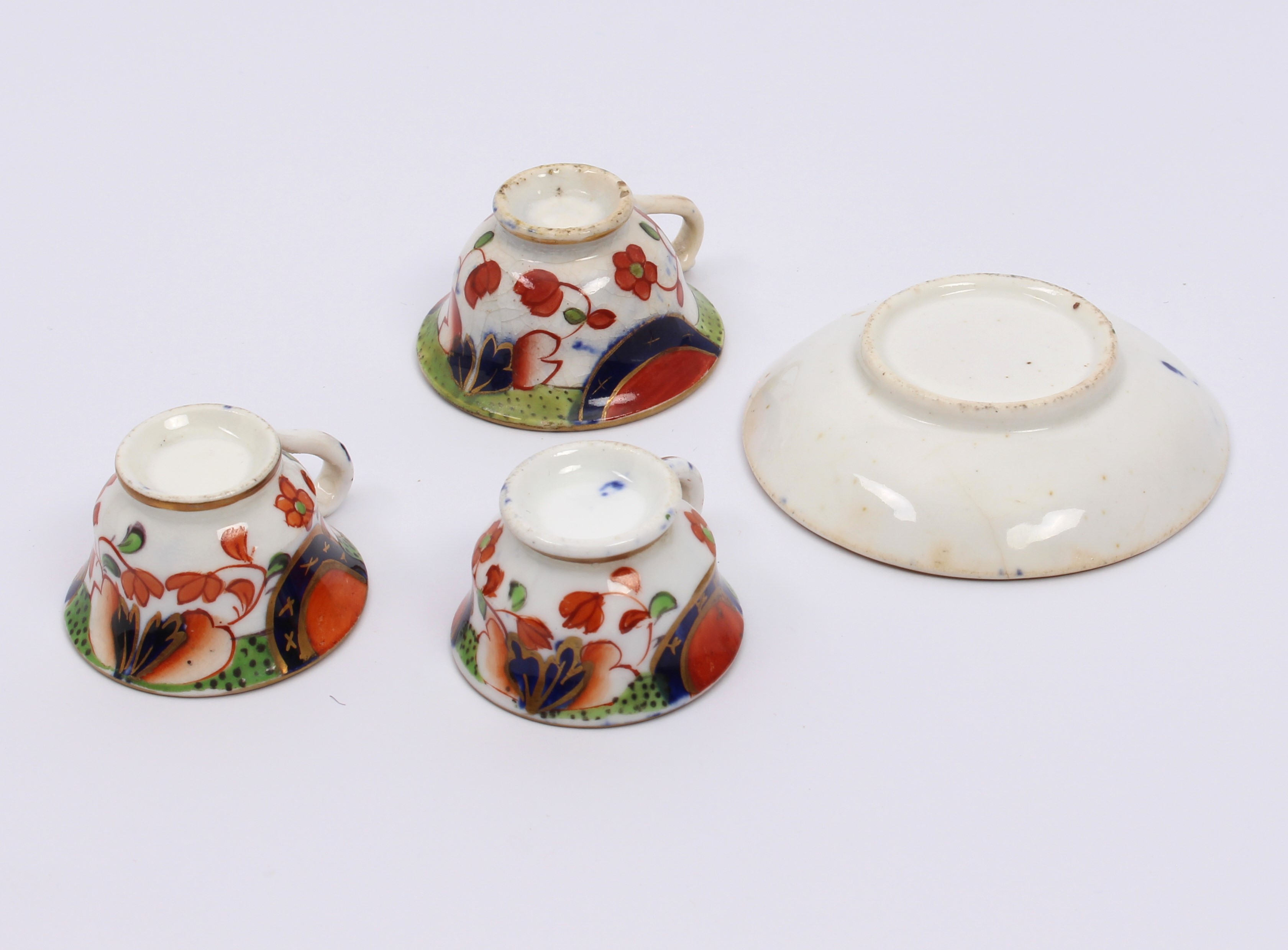 A mid-19th century miniature tea cup and saucer - painted with Imari style decoration, the saucer - Image 2 of 2