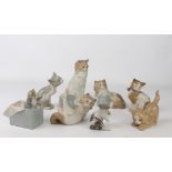 Seven porcelain figures of cats and Kittens by Lladro and Nao - the largest 17.8 cm high; together