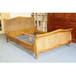 A caned pale mahogany king size sleigh bed - in the French 19th century style, modern, the camel-