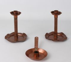A pair of Arts & Crafts style copper candlesticks - early 20th century, with cluster column stems