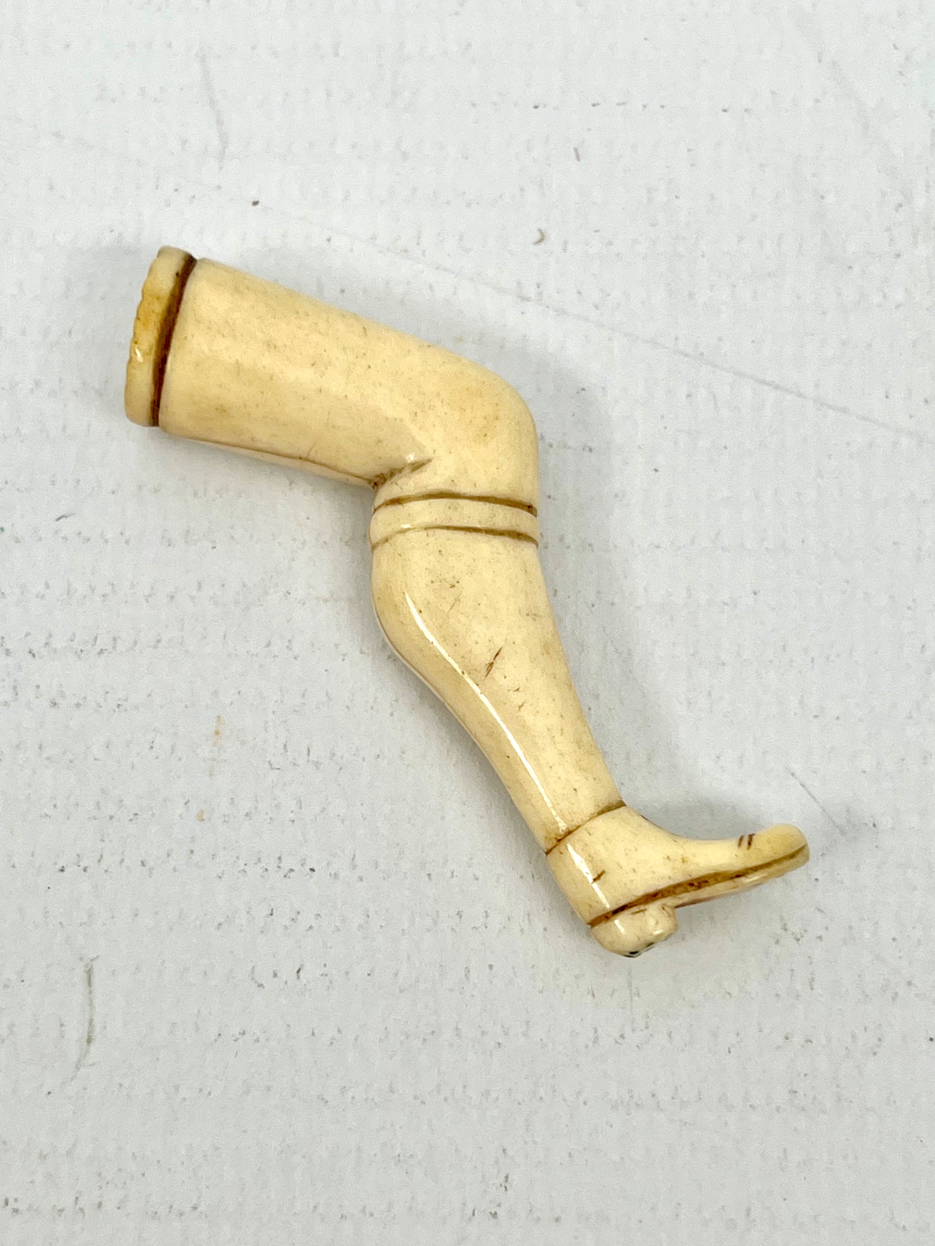 An early 19th century prisoner of war carved-bone novelty pipe-tamper - in the form of a shapely - Image 2 of 2