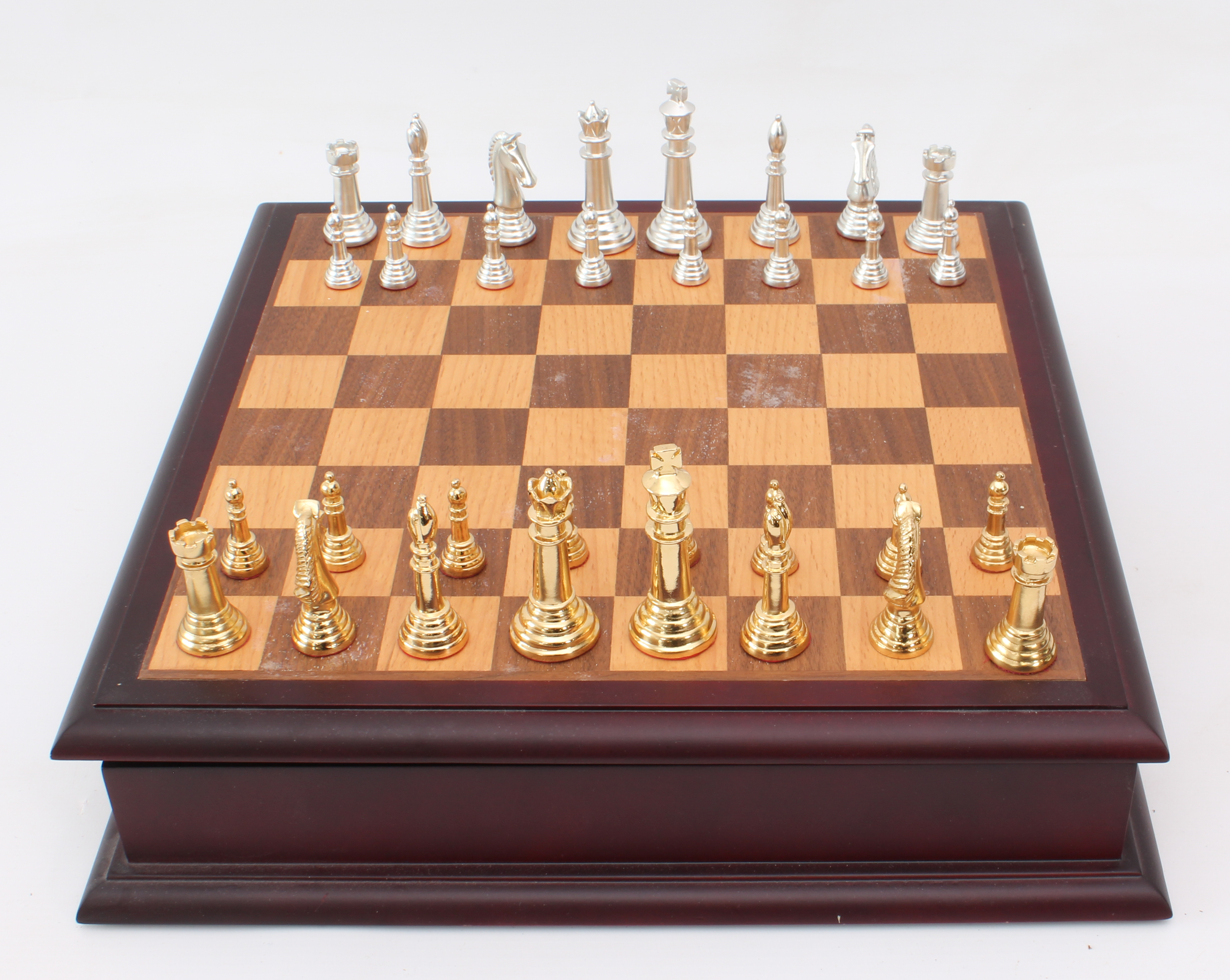 A cased chess set and board - late 20th century, the silver-coloured and gold-coloured cast metal - Image 4 of 4