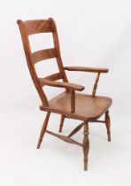 A beech and elm ladder back armchair - c.1900, the back with three graduated rails over a saddle